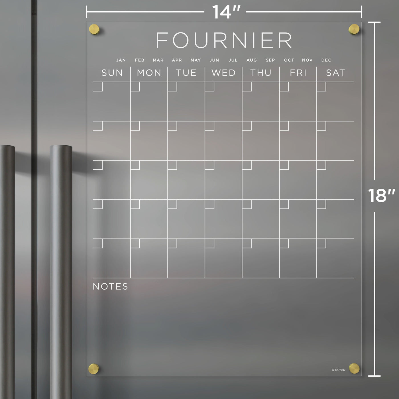 The Girl Friday Acrylic Fridge Calendar, customizable with a family name, features a clear acrylic design with gold hardware, an empty days and months grid, a NOTES section at the bottom, and includes wet-erase markers. It measures 14 inches wide by 18 inches tall.