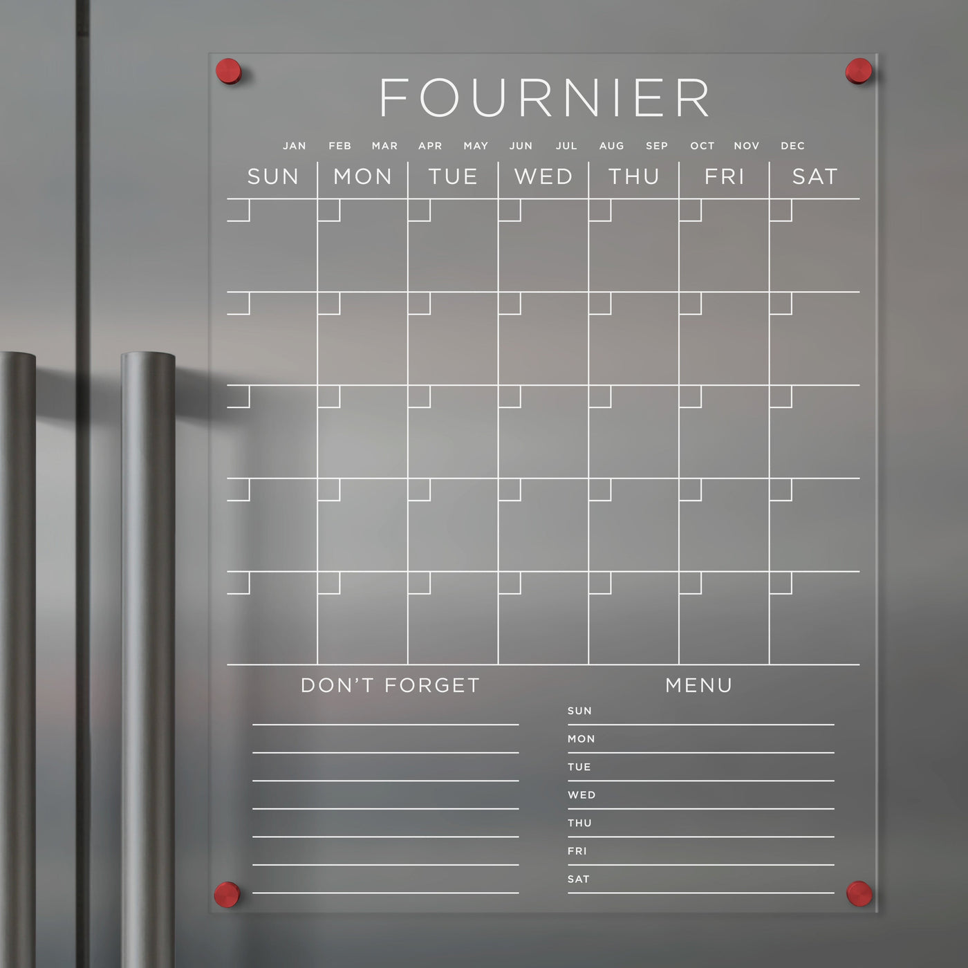 The Girl Friday Clear Acrylic Monthly Fridge Calendar boasts a weekly grid layout, sections for months, weekdays, Dont Forget, and Menu. Use wet-erase markers on its magnetic surface with red corner magnets for style and stability. Personalize with your family name in white text.