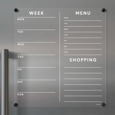 The Girl Friday Acrylic Fridge Planner has customizable Week and Menu columns with weekdays and a convenient Shopping section. Its modern design, compatible with dry-erase markers, features minimalist text for easy planning.