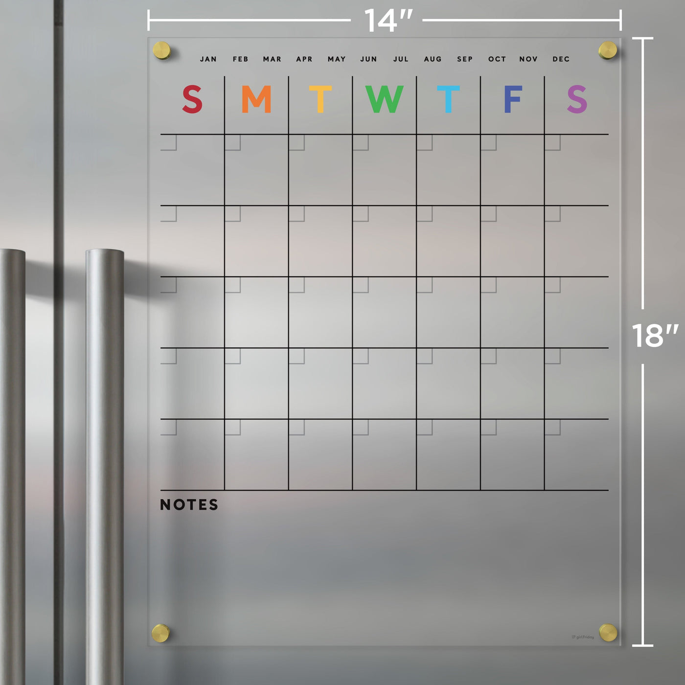 The Clear Acrylic Fridge Calendar with Rainbow Text by Girl Friday Shop attaches to a metal surface and is ideal for dry-erase markers. It has a weekly layout with colorful initials for days, monthly headers, note space at the bottom, and measures 14 x 18.