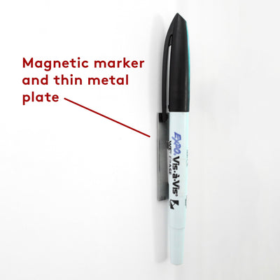 A black-capped marker is vertically attached to a thin metal plate on a white backdrop. A red arrow emphasizes Magnetic marker and thin metal plate, ideal for organizing your Vertical White Acrylic Dry Erase Weekly Calendar by Girl Friday Shop.