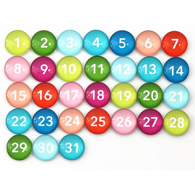 A grid of Girl Fridays Number Magnets - Multi-colored, numbered 1 to 31 with unique hues, is arranged in five orderly rows on a white backdrop.